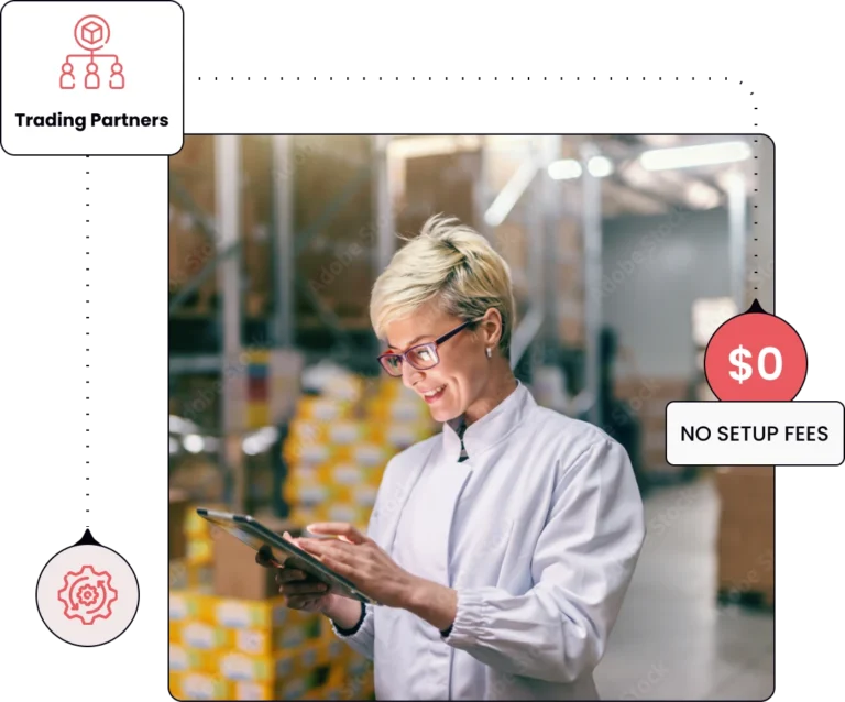 a woman standing in a warehouse and looking at her tablet